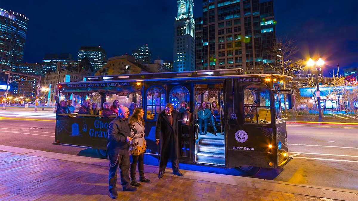 The other passengers are in the bus, while the three individuals are outside.